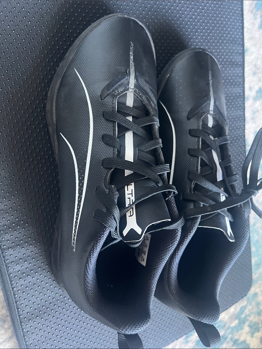 Puma kids Black Athletic Shoes with White Accents
